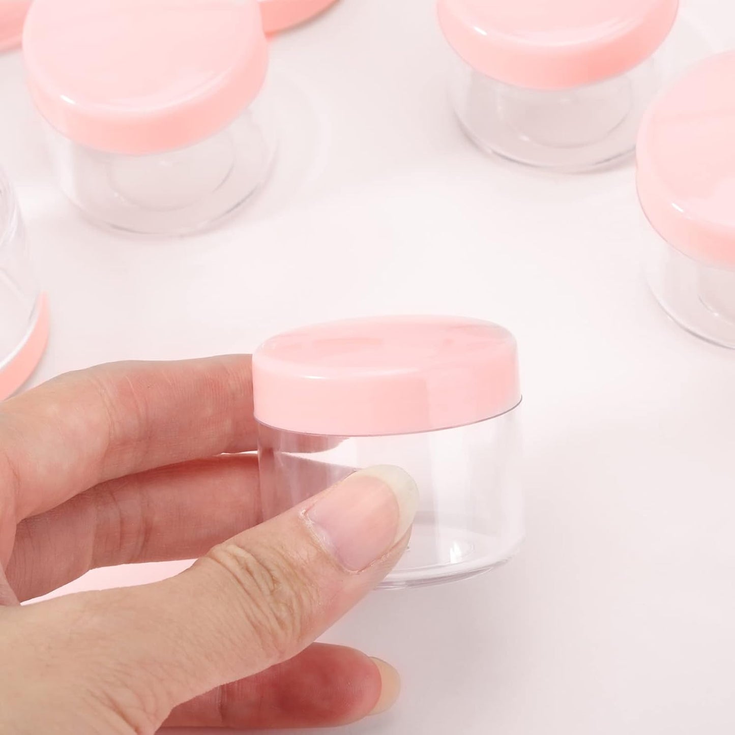 100 Count 20g Sample Containers with Lids，Refillable Cosmetic Containers Small Plastic Jars Lip Scrub Container - Pink