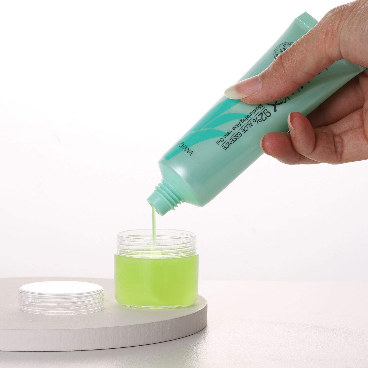 Refillable Cosmetic Sample Jars - 100 Pack 20g (0.7oz) Clear Small Travel Containers with Lids + 10 Mini Makeup Spatulas - BPA Free