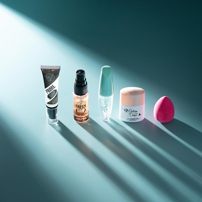 W7 On the Go Essentials Set - Mini Makeup Must-Haves with Primer, Setting Spray, Mascara, Golden Glow Bronzing Drops & Beauty Sponge - Travel or Handbag Size Essentials